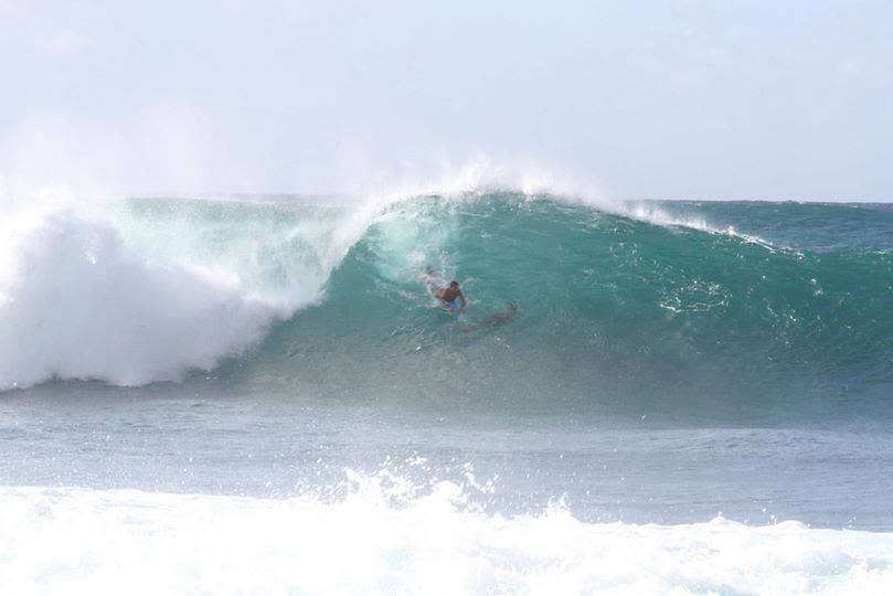 Cody bodyboarding a large wave