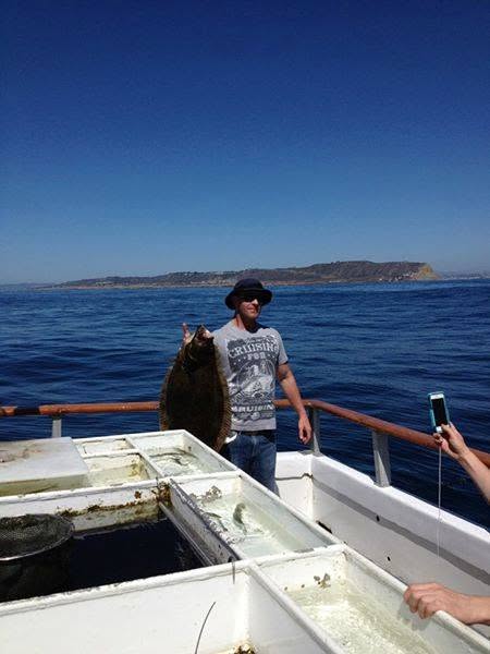 Angler with halibut catch, San Diego