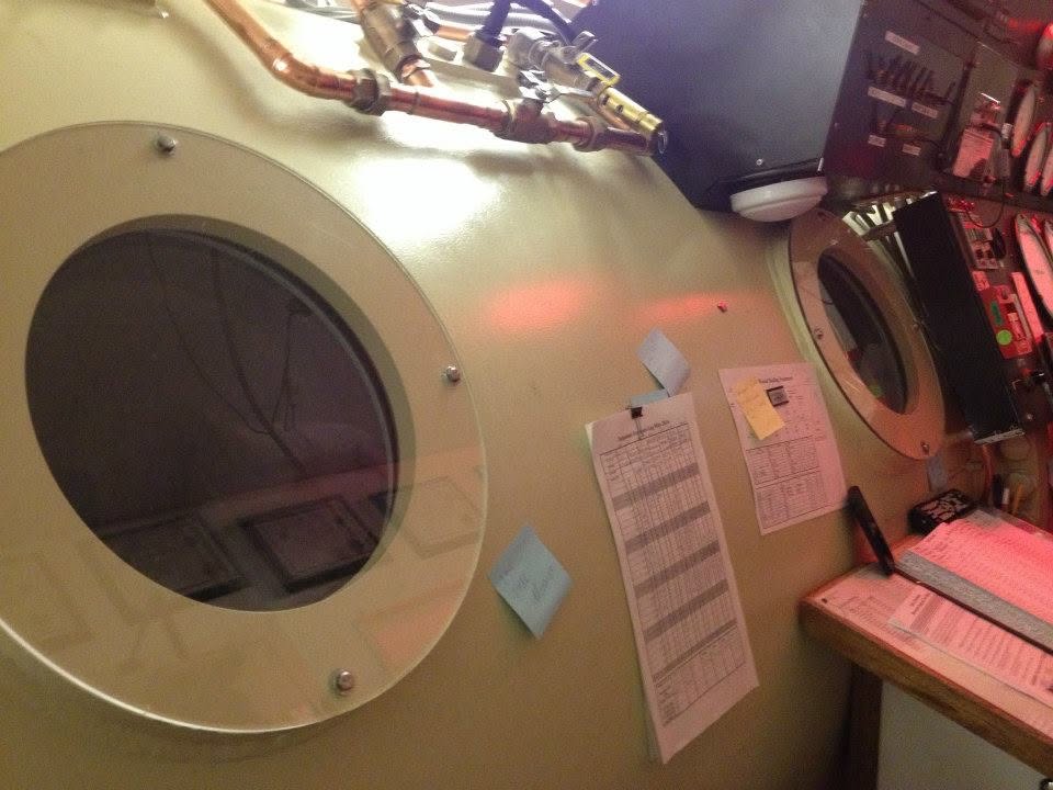 Hyperbaric chamber viewports and dive log sheets