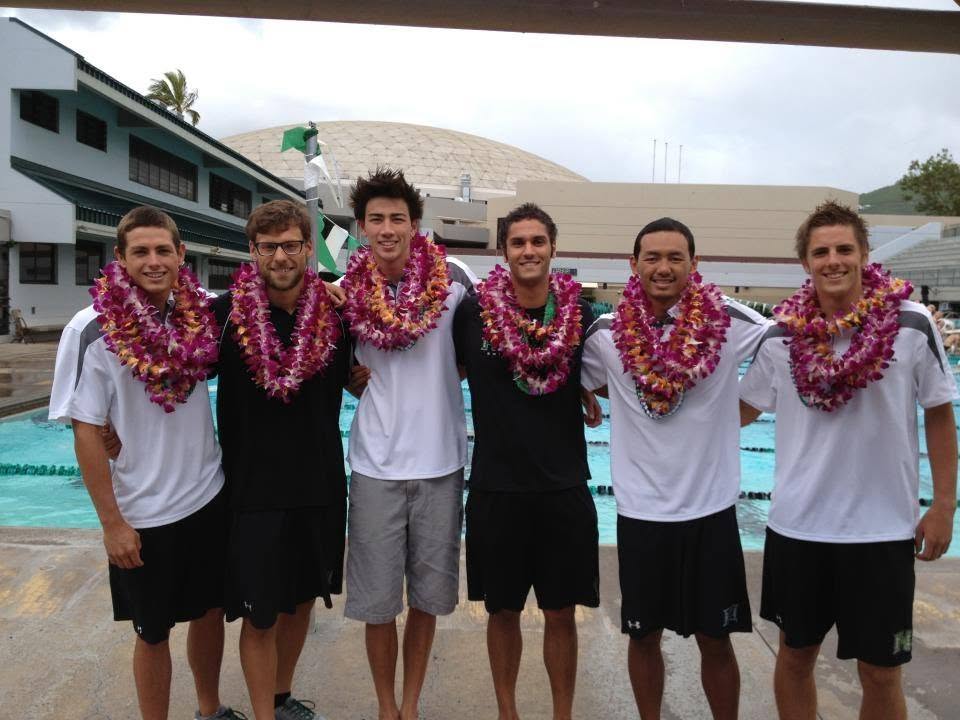 Team celebrating with lei