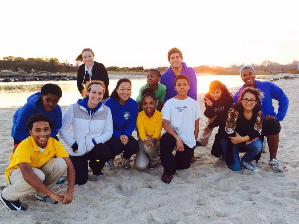 Student group at sunset on the beach