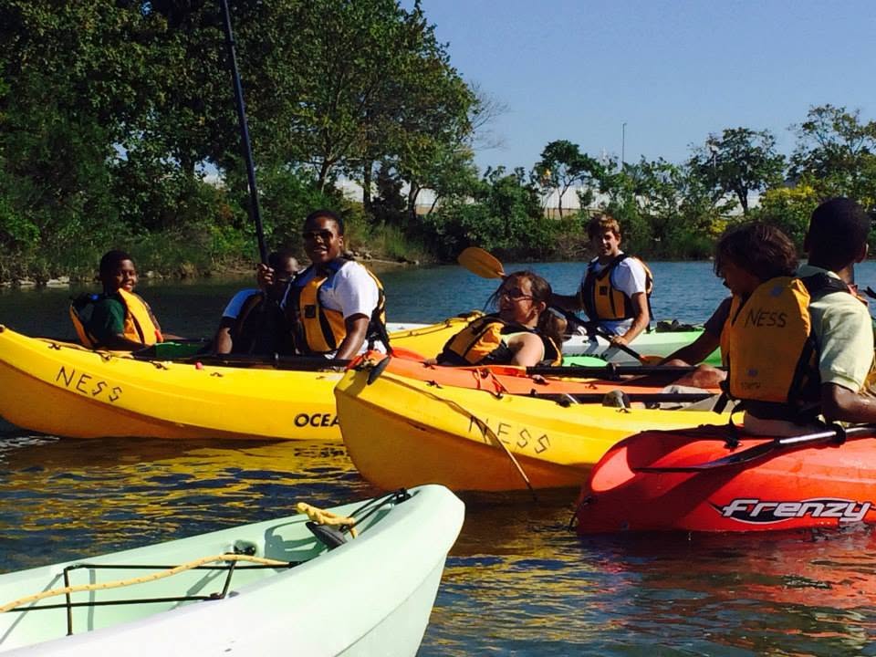 Student kayaking group on the water
