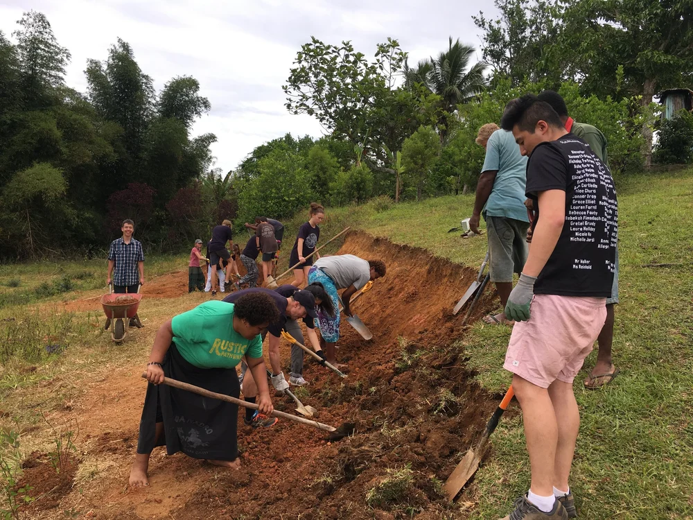 Digging the foundation trench for the rebuilt school