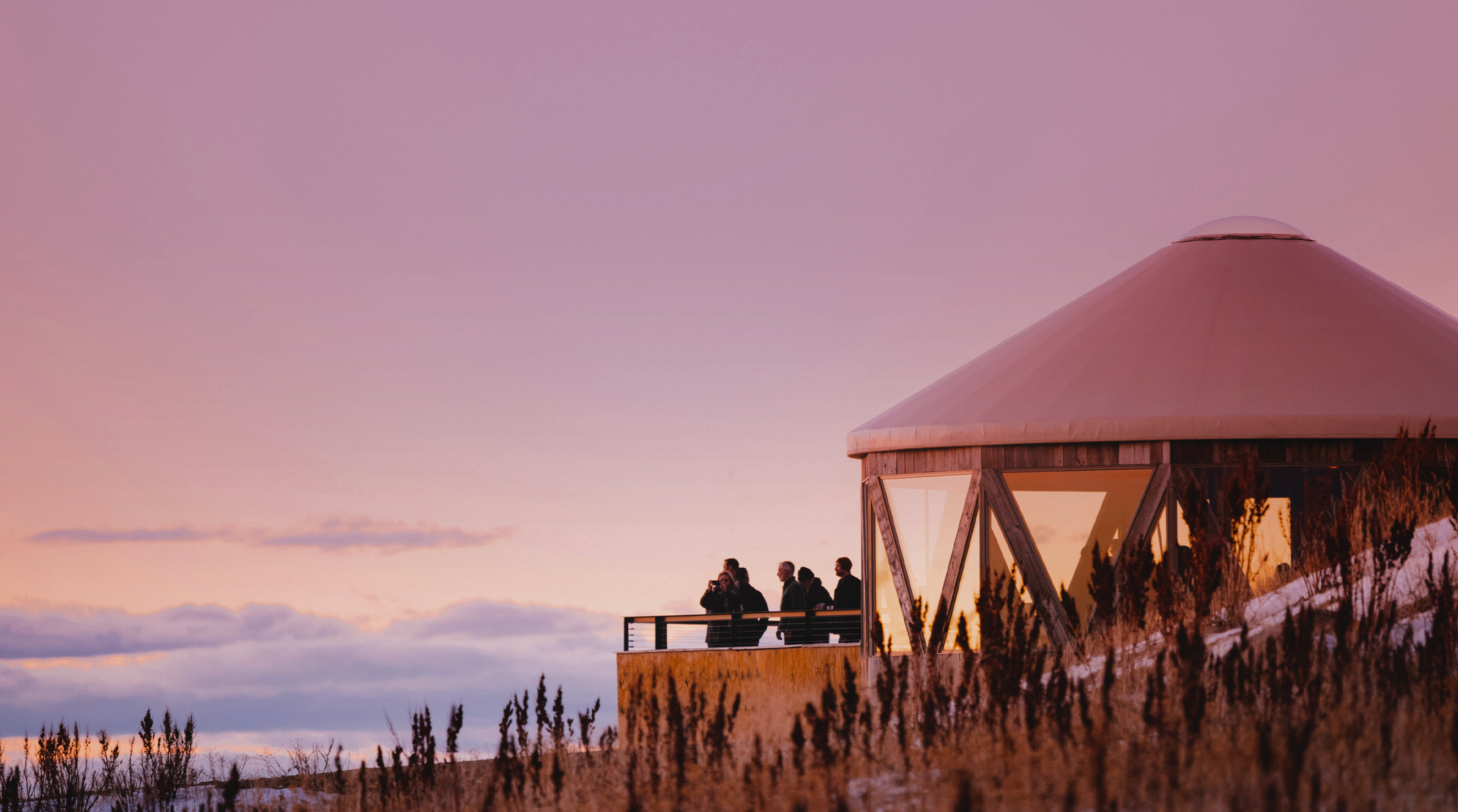 Summit gathering at dusk, viewing deck