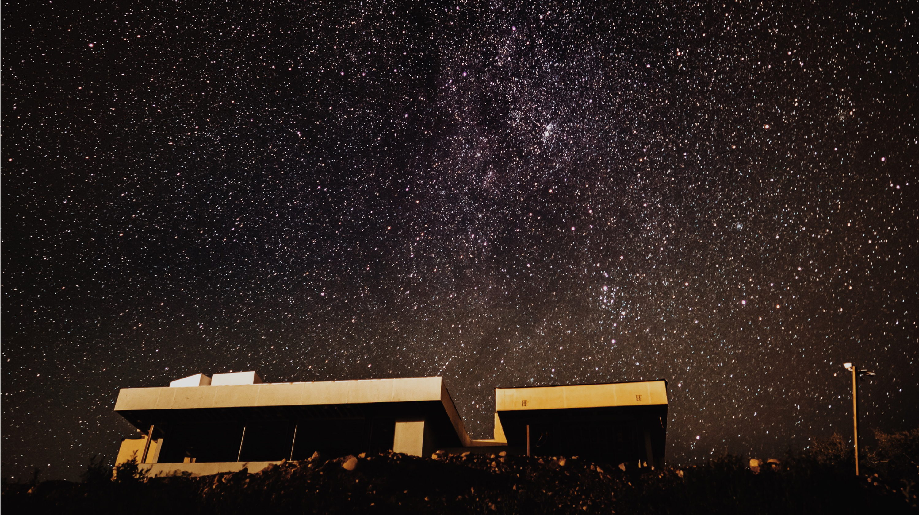 Summit venue beneath a star-filled night sky