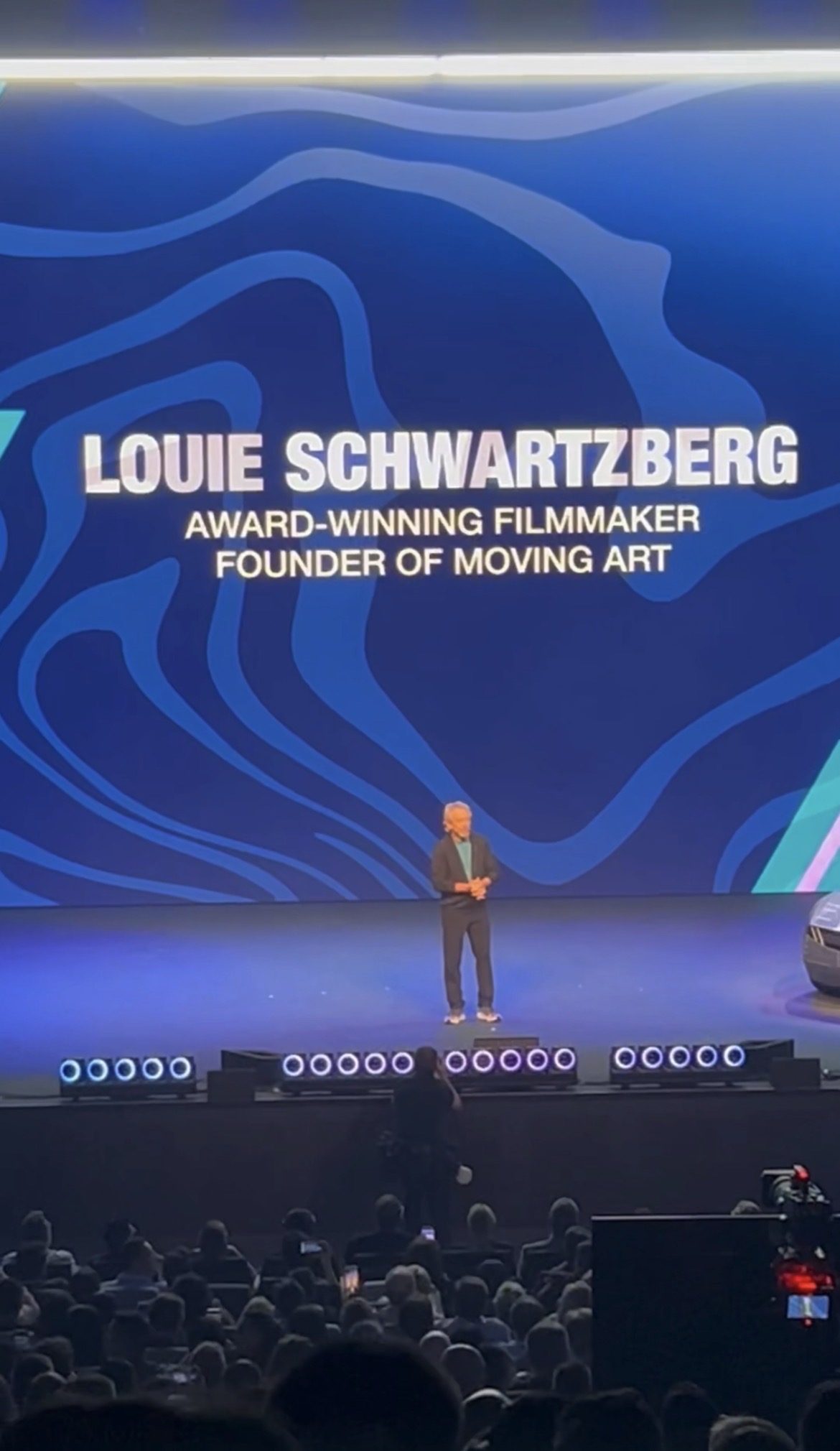 Louie Schwartzberg speaking at a YPO event